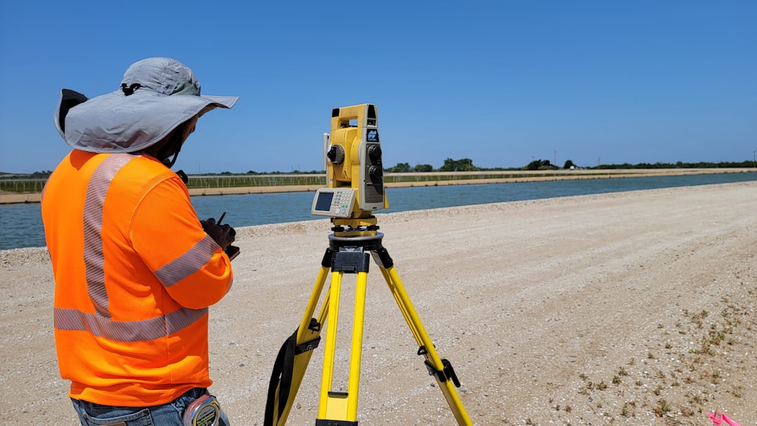 GPS land survey surveyor using GNSS rover in the field